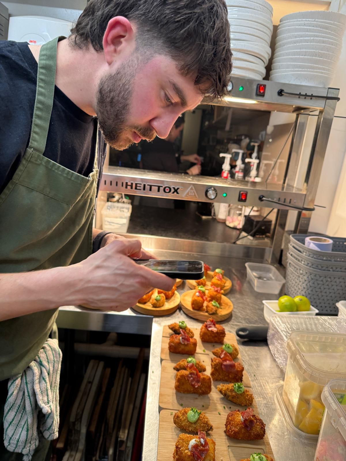 Chef Adrian plating tapas in the kitchen